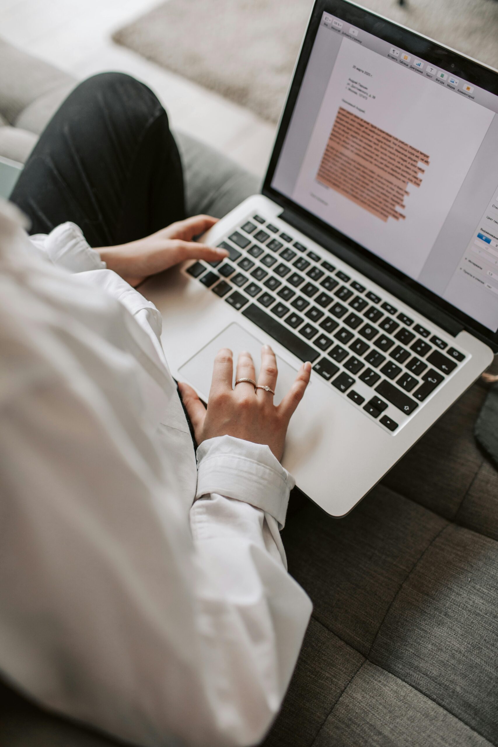 Woman writing on a laptop